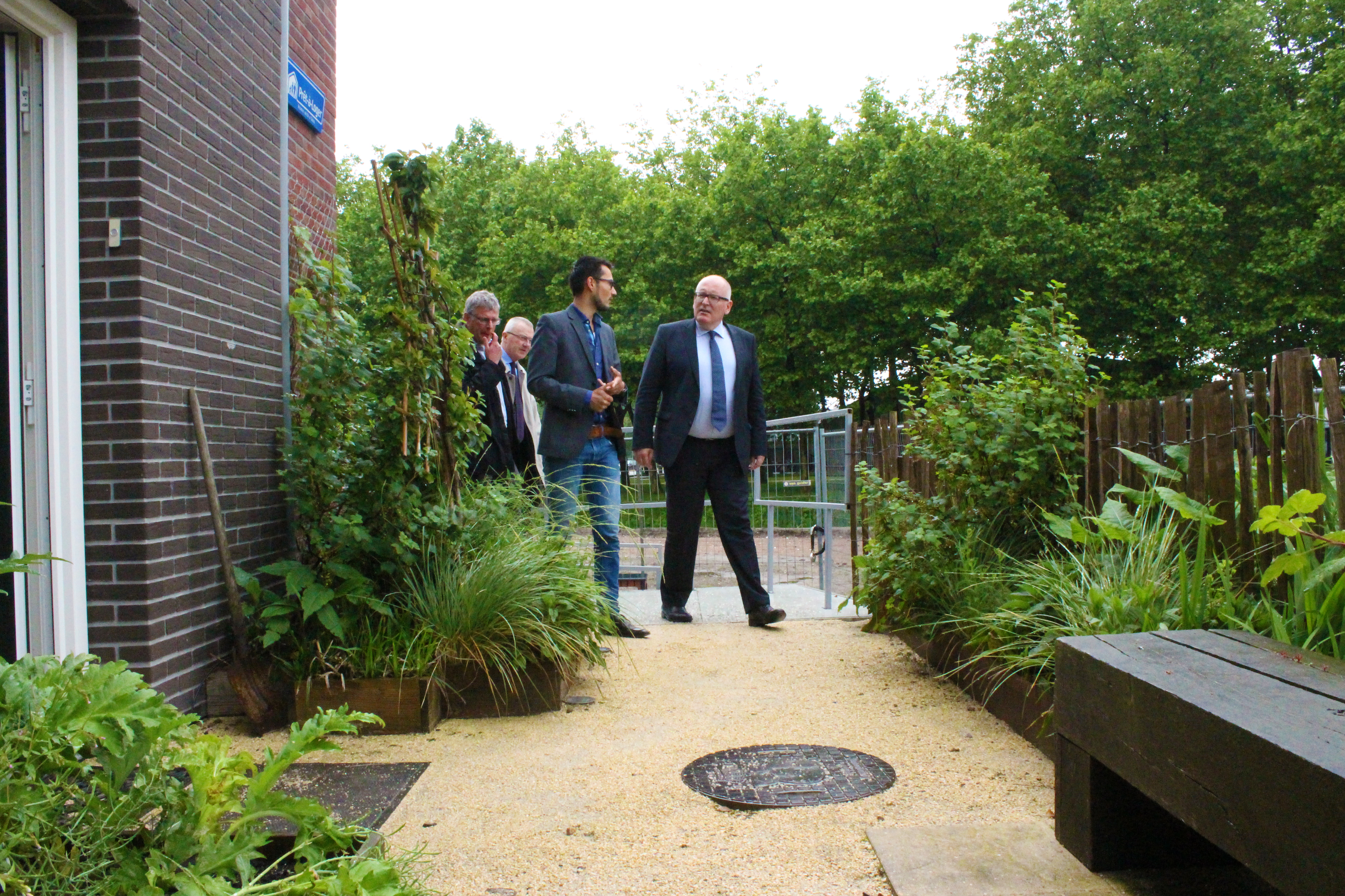 Mr. Frans Timmermans entering the Pret-a-loger